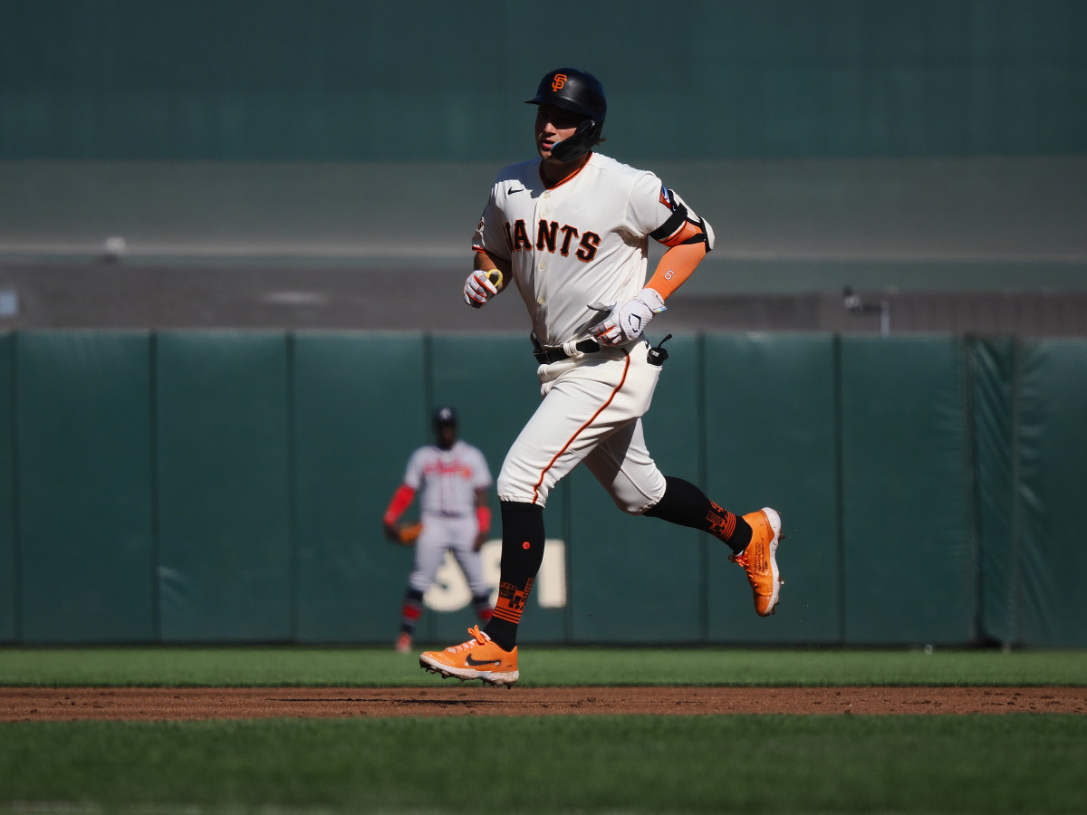 SF Giants third baseman Casey Schmitt rounds the bases on a solo home run against the Atlanta Braves during the second inning at Oracle Park on August 27, 2023.
