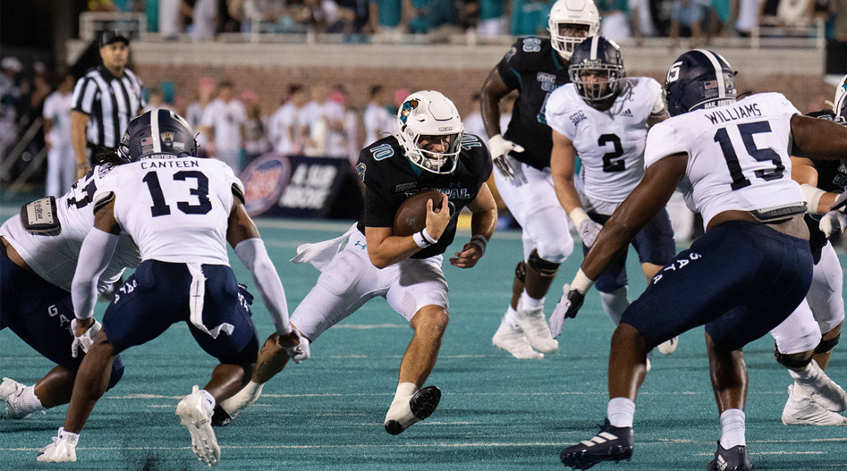 Coastal Carolina QB Grayson McCall crashes into the Georgia Southern defense.
