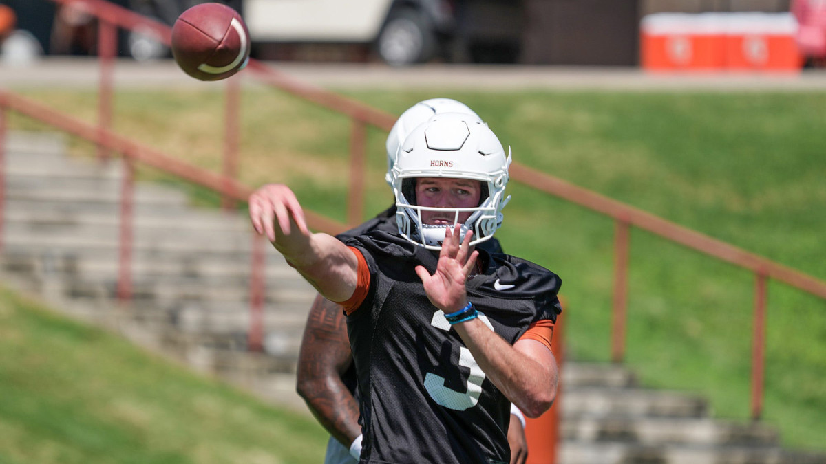 Texas Longhorn Quinn Ewers passes the ball during their first pre-season practice .