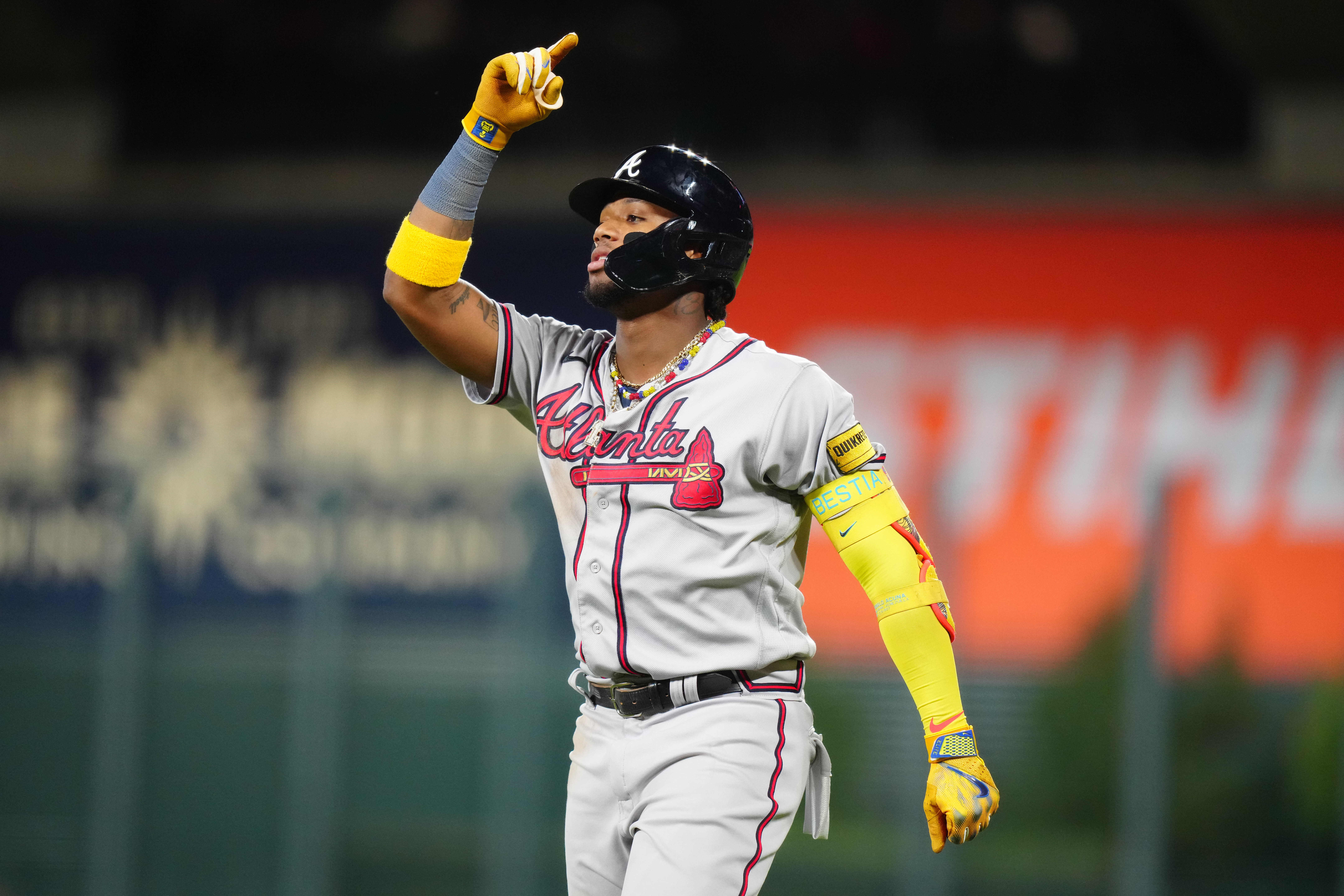 Aug 29, 2023; Denver, Colorado, USA; Atlanta Braves right fielder Ronald Acuna Jr. (13) reacts to his single in the fifth inning against the Colorado Rockies at Coors Field.
