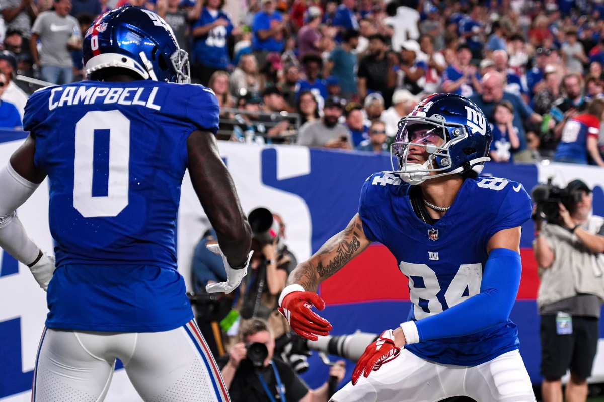 Aug 18, 2023; East Rutherford, New Jersey, USA; New York Giants wide receiver Jalin Hyatt (84) celebrates with New York Giants wide receiver Parris Campbell (0) after catching a touchdown pass against the Carolina Panthers during the second quarter at MetLife Stadium.