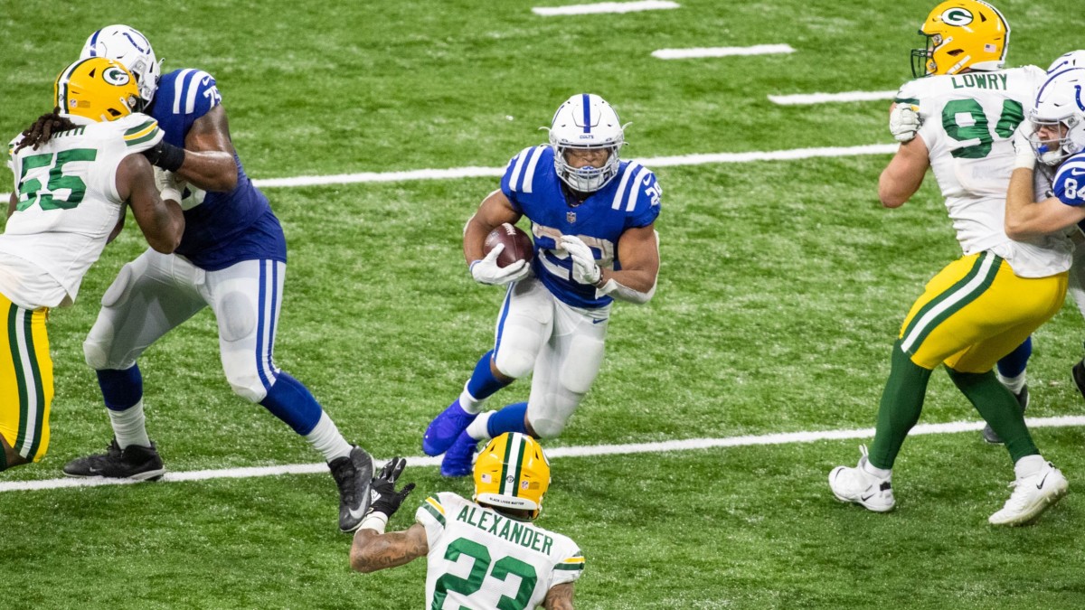 Nov 22, 2020; Indianapolis, Indiana, USA; Indianapolis Colts running back Jonathan Taylor (28) runs the ball in the second half against the Green Bay Packers at Lucas Oil Stadium. Mandatory Credit: Trevor Ruszkowski-USA TODAY Sports