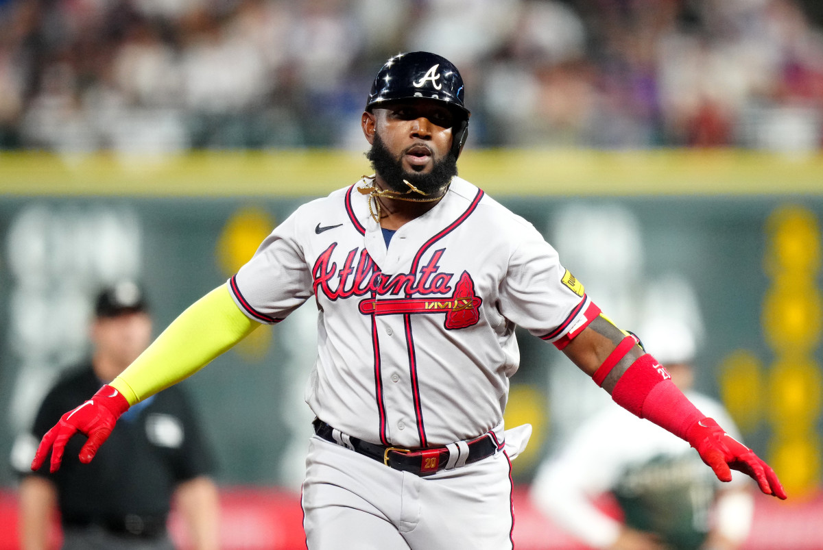Aug 30, 2023; Denver, Colorado, USA; Atlanta Braves designated hitter Marcell Ozuna (20) celebrates his solo home run in the sixth inning against the Colorado Rockies at Coors Field.