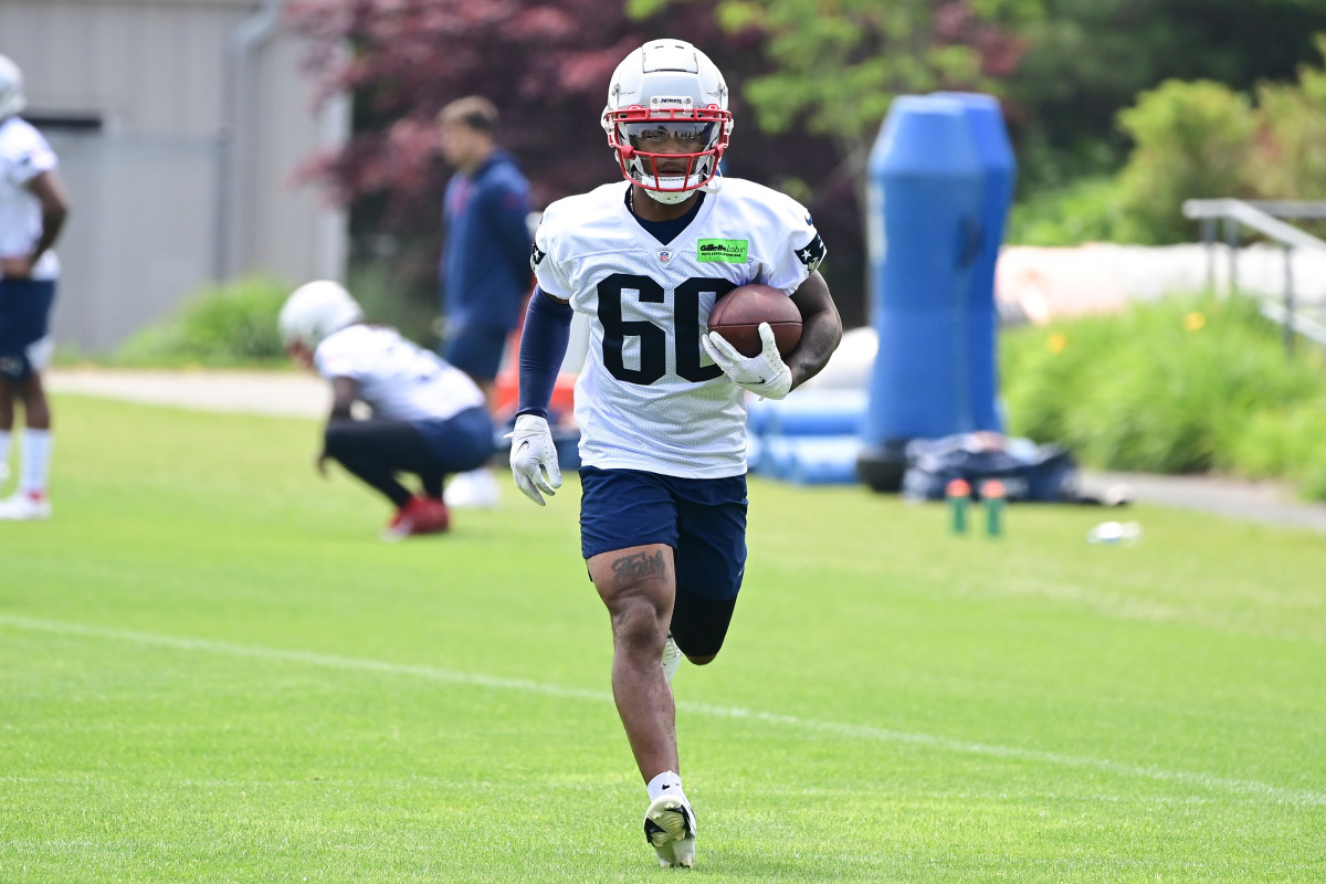Jun 12, 2023; Foxborough, MA, USA; New England Patriots wide receiver Demario Douglas (60) runs after making a catch at the Patriots minicamp at Gillette Stadium. Mandatory Credit: Eric Canha-USA TODAY Sports