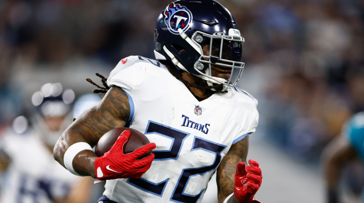 Jan 7, 2023; Jacksonville, Florida, USA; Tennessee Titans running back Derrick Henry (22) runs the ball against the Jacksonville Jaguars during the first quarter at TIAA Bank Field. Mandatory Credit: Douglas DeFelice-USA TODAY Sports  