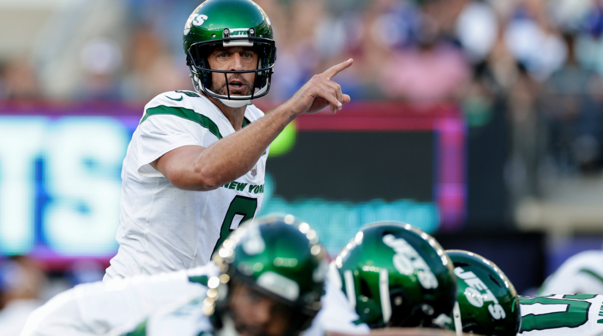 New York Jets quarterback Aaron Rodgers (8) calls out a play during the first half of an NFL preseason football game against the New York Giants, Saturday, Aug. 26, 2023, in East Rutherford, N.J. (AP Photo/Adam Hunger)