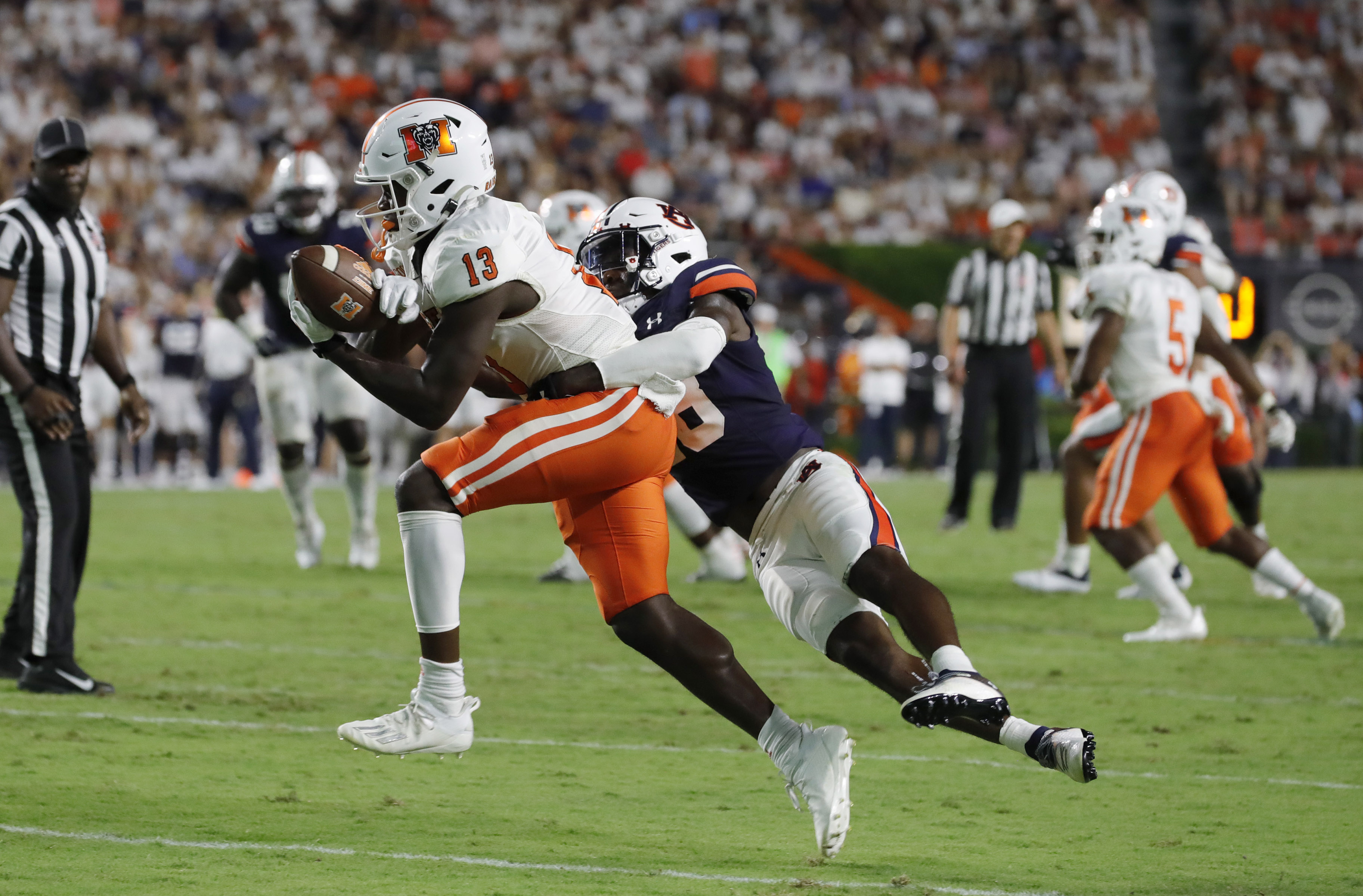 Mercer Bears receiver Ty James makes a contested catch versus the Auburn Tigers.