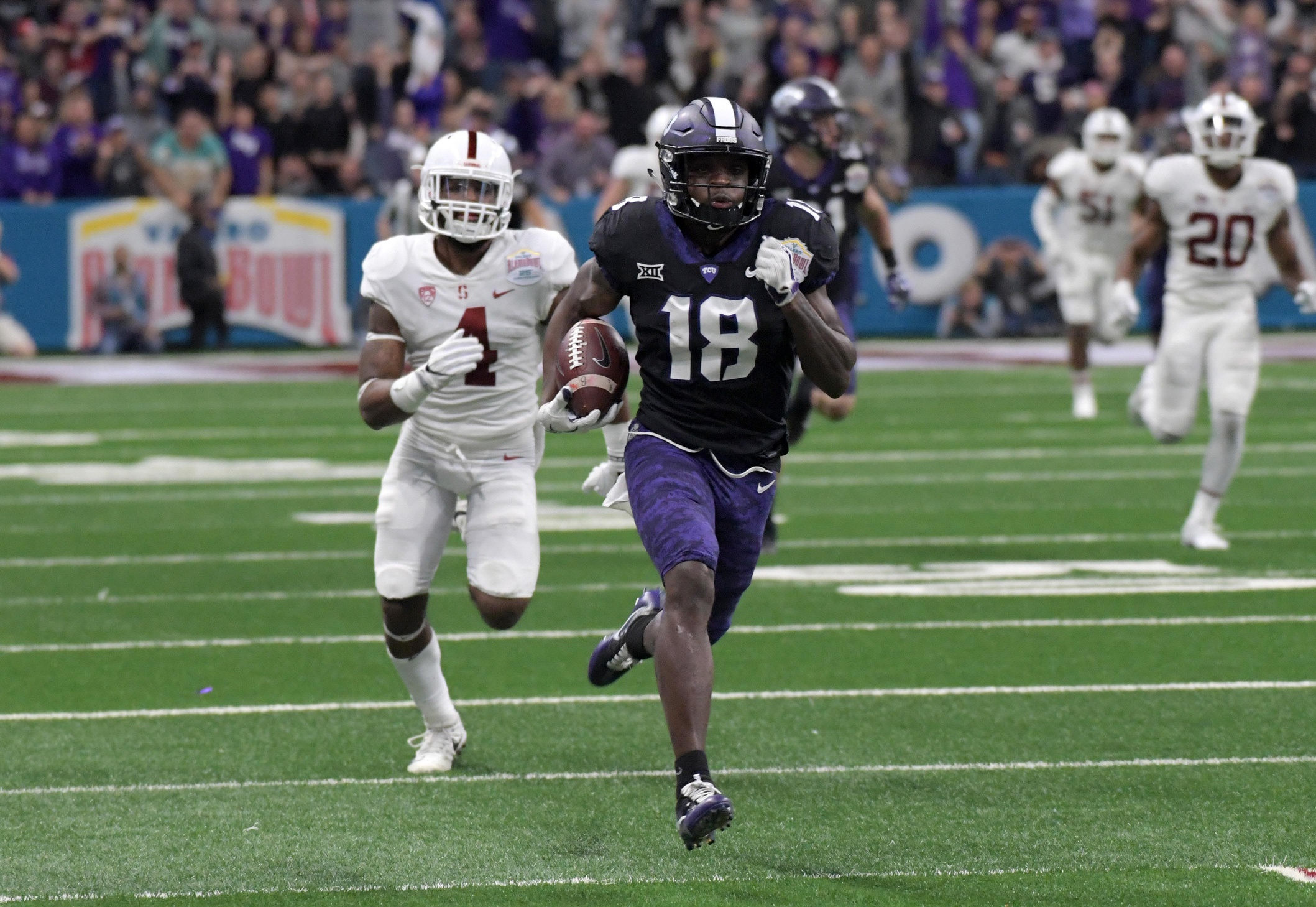 Dec 28, 2017; San Antonio, TX, United States; TCU Horned Frogs wide receiver Jalen Reagor (18) scores on a 93-yard touchdown reception in the third quarter against the Stanford Cardinal the 2017 Alamo Bowl at Alamodome. TCU defeated Stanford 39-37. 