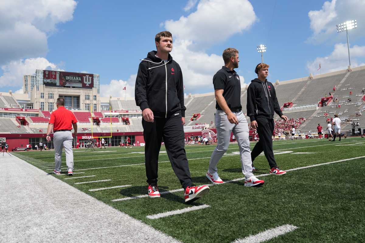Junior Kyle McCord (left), coach Corey Dennis and sophomore Devin Brown arrive at Memorial Stadium ahead of Ohio State's football game against Indiana.