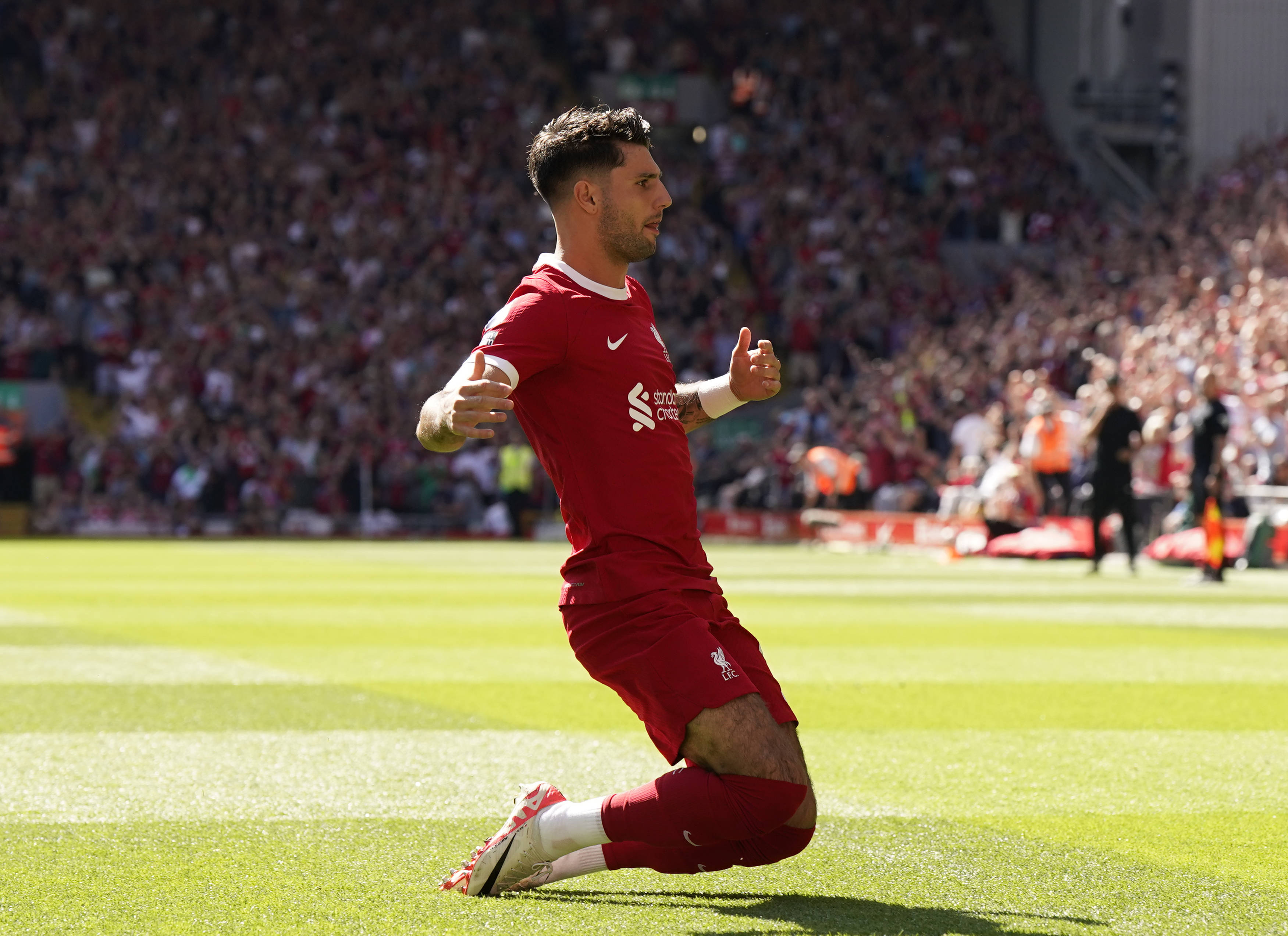 Dominik Szoboszlai pictured celebrating after scoring the first goal of his Liverpool career during an EPL game against Aston Villa at Anfield in September 2023