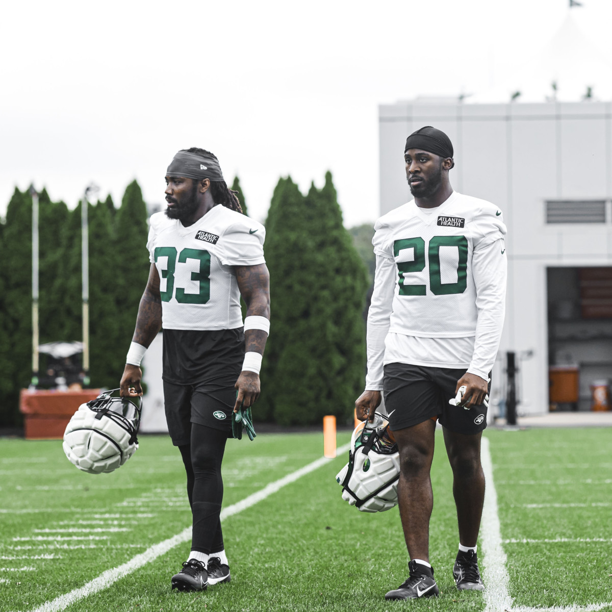 Jets' running backs Dalvin Cook (33) and Breece Hall (20) in Florham Park