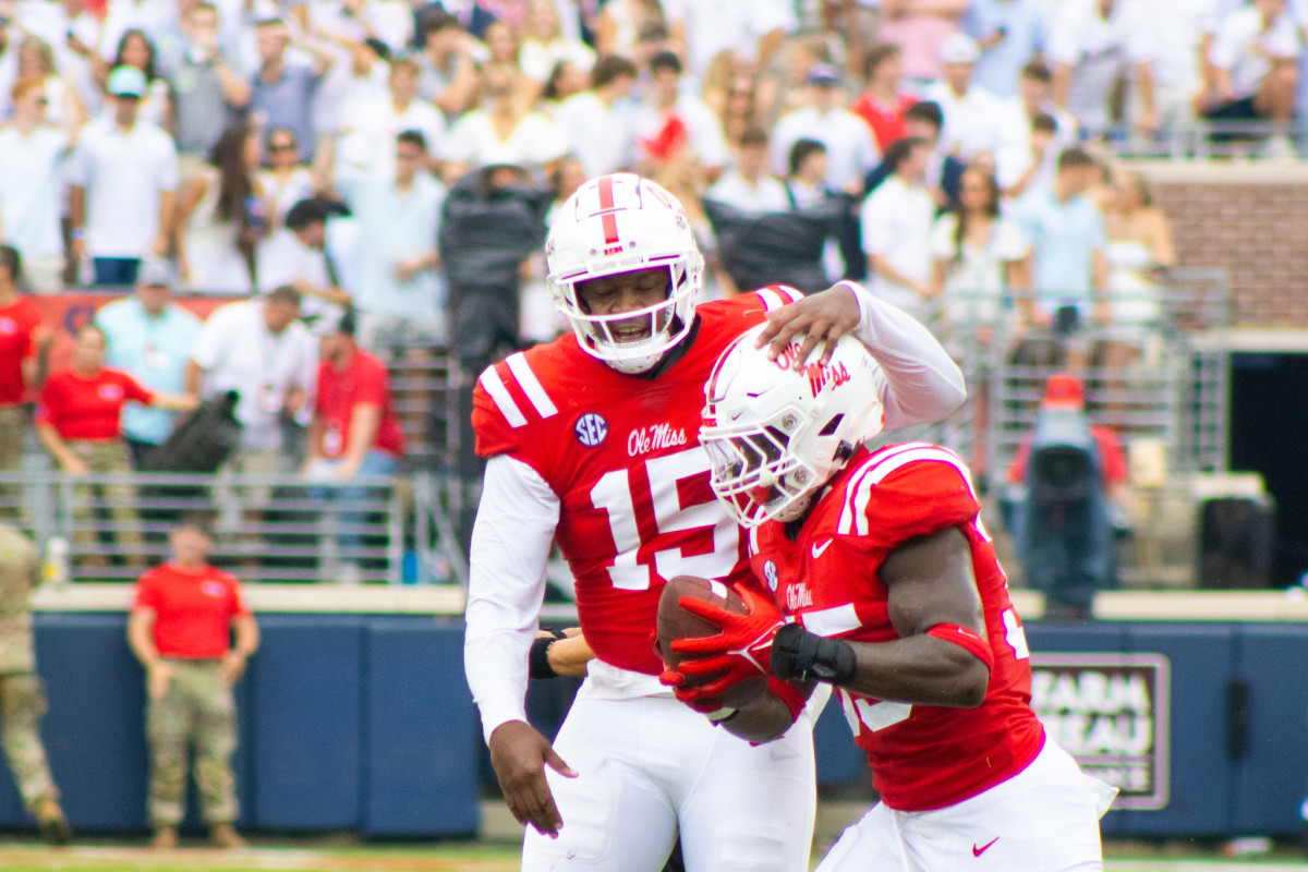 Ole Miss Rebels defensive lineman Jared Ivey celebrates a fumble recovery with running back Fred McAfee (#35) versus the Mercer Bears (2023). 