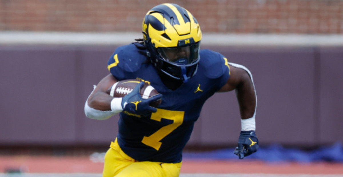 Michigan Wolverines running back Donovan Edwards on a carry during a college football game in the Big Ten.