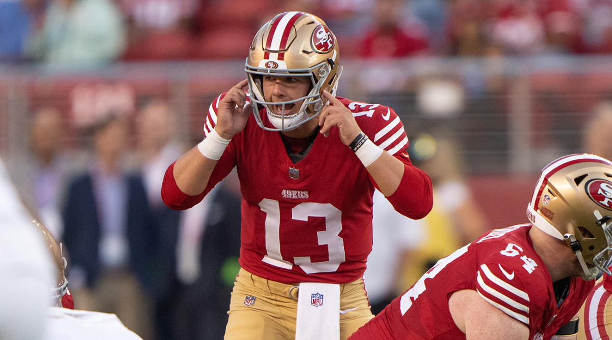 49ers quarterback Brock Purdy (13) signals during the first quarter against the Chargers at Levi’s Stadium.