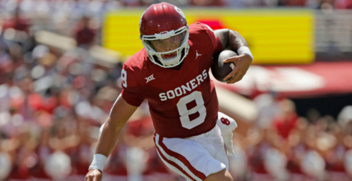 Oklahoma Sooners quarterback Dillon Gabriel on a run during a college football game.