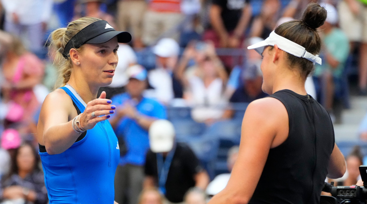 Caroline Wozniacki meets Jennifer Brady at center court after defeating her in the third round of the 2023 U.S. Open