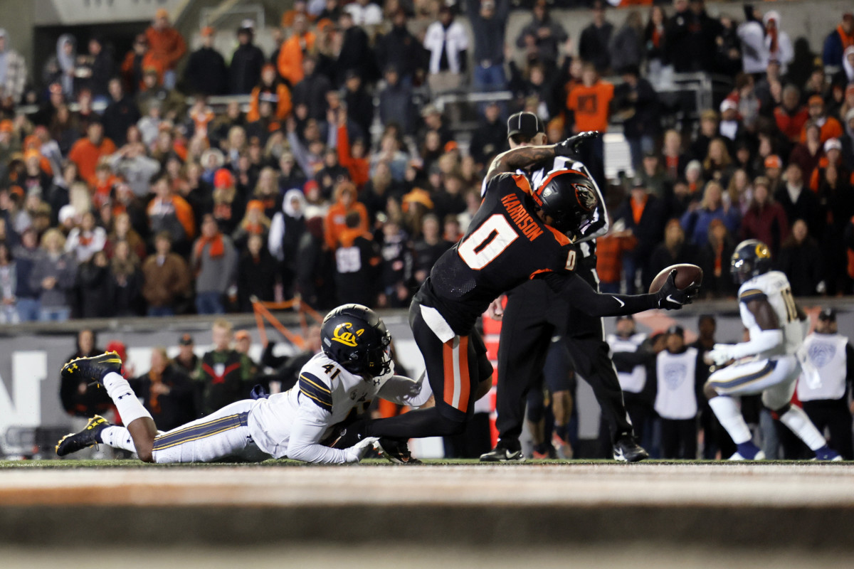 Nov 12, 2022; Corvallis, Oregon, USA; Oregon State Beavers wide receiver Tre'Shaun Harrison (0) dives into the end zone to score a touchdown against California Golden Bears corner back Isaiah Young (41) during the second half at Reser Stadium. Mandatory Credit: Soobum Im-USA TODAY Sports