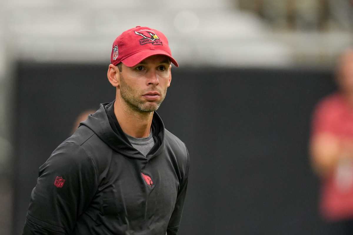 Jonathan Gannon looks ahead wearing a Cardinals baseball cap
