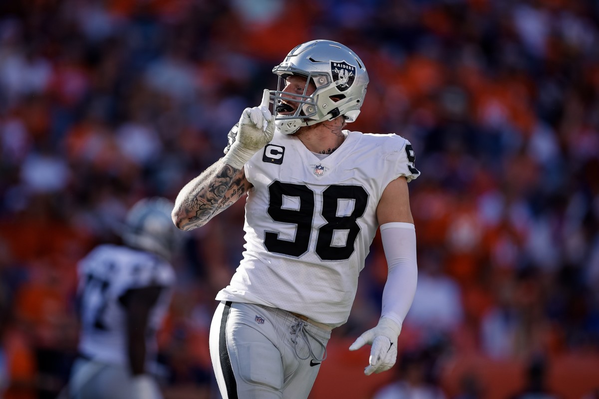 Las Vegas Raiders defensive end Maxx Crosby (98) reacts after a play in the second quarter against the Denver Broncos at Empower Field at Mile High.