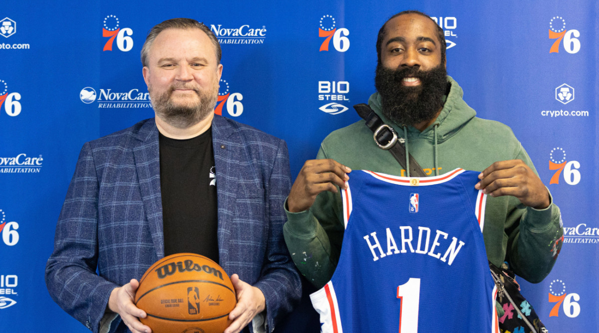 76ers president Daryl Morey poses with James Harden after the team acquired him via trade with the Nets.