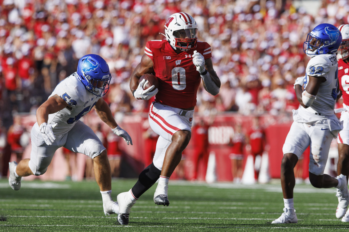 Sep 2, 2023; Madison, Wisconsin, USA; Wisconsin Badgers running back Braelon Allen (0) rushes with the football during the third quarter against the Buffalo Bulls at Camp Randall Stadium. Mandatory Credit: Jeff Hanisch-USA TODAY Sports