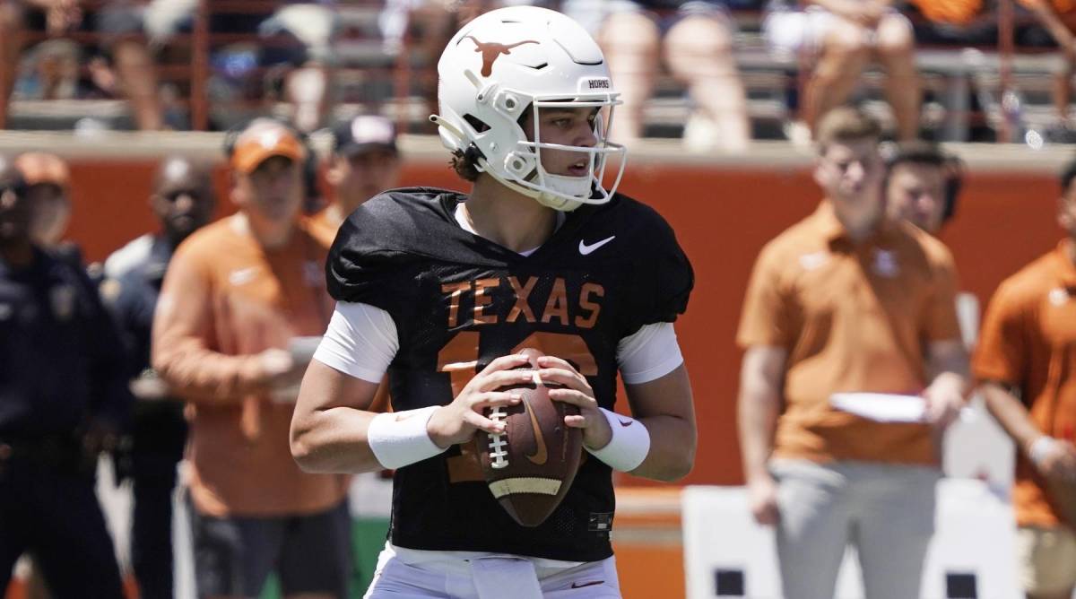 Texas quarterback Arch Manning drops back to pass in a Spring practice.