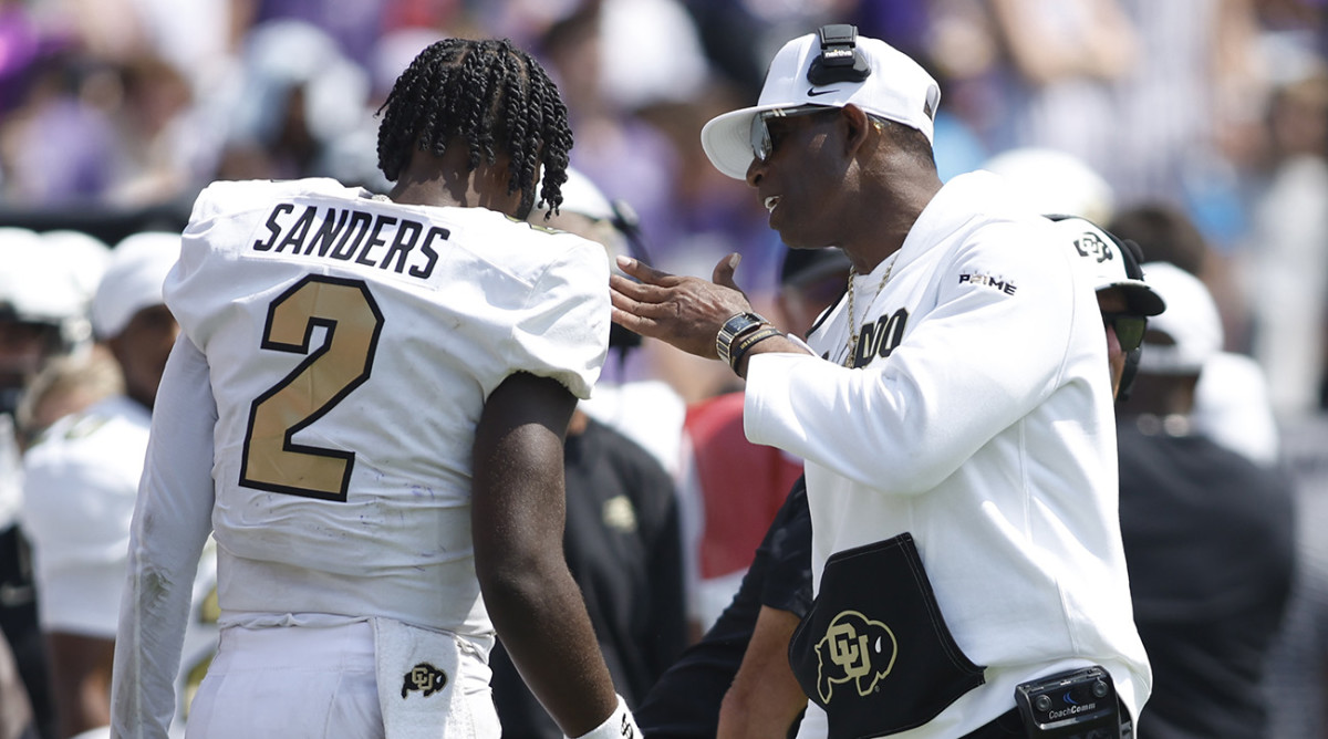Colorado quarterback Shedeur Sanders and head coach Deion Sanders