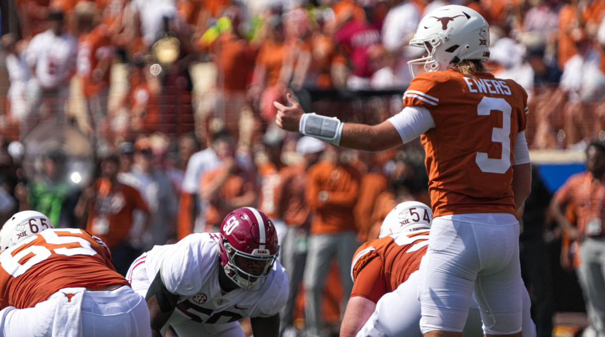 Texas quarterback Quinn Ewers directs his team at the line of scrimmage during the game against Alabama.