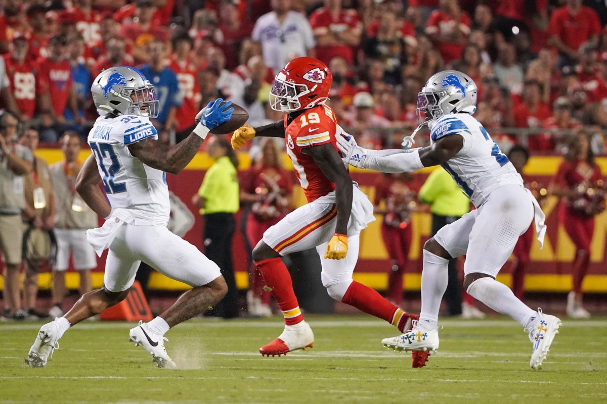 Lions safety Brian Branch (32) intercepts a pass intended for Chiefs wide receiver Kadarius Toney (19) during the second half at GEHA Field at Arrowhead Stadium in the NFL's season opener. Branch returned the interception for a touchdown.