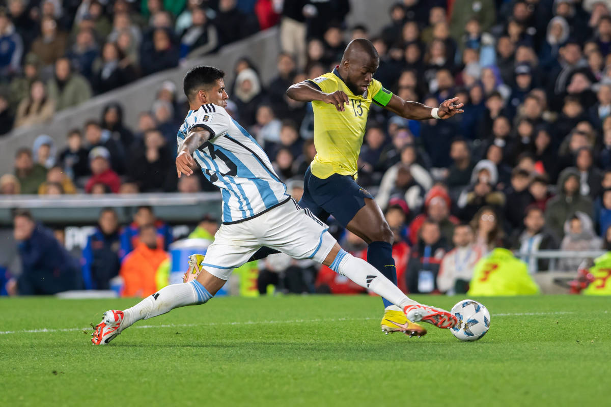 Argentina defender Cristian Romero pictured (left) tackling Ecuador forward Enner Valencia during a World Cup qualifier in September 2023