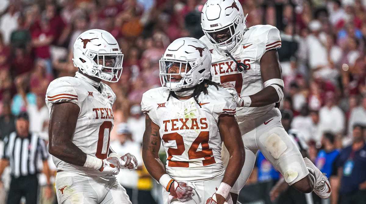Texas Longhorns running back Jonathon Brooks (center) celebrates a touchdown against Alabama