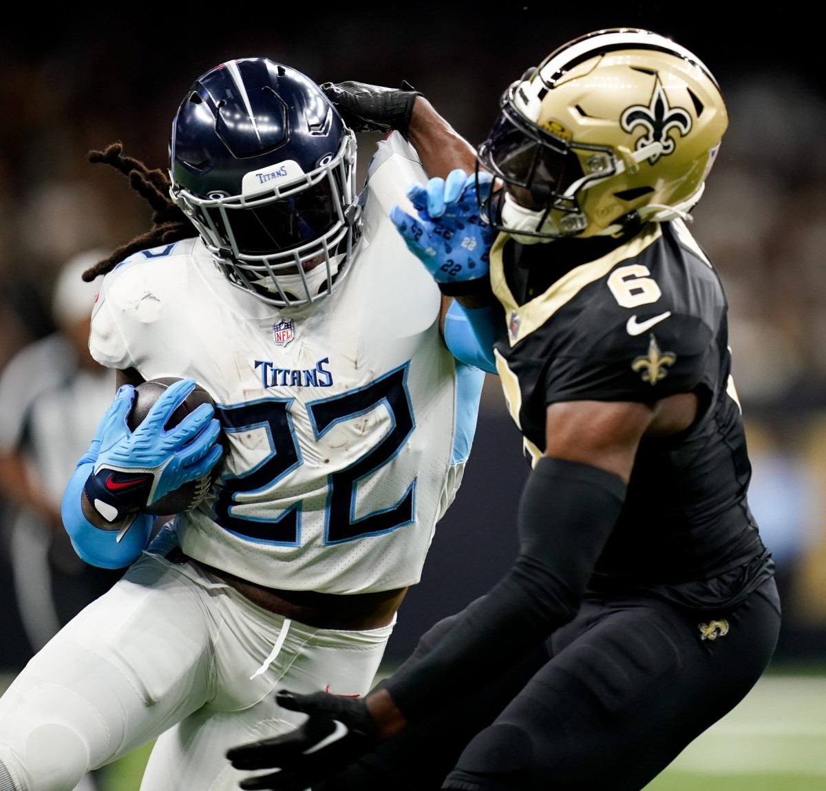 Derrick Henry (22) gets a first down as New Orleans Saints safety Marcus Maye (6) tries to stop him in the first quarter at the Caesars Superdome.