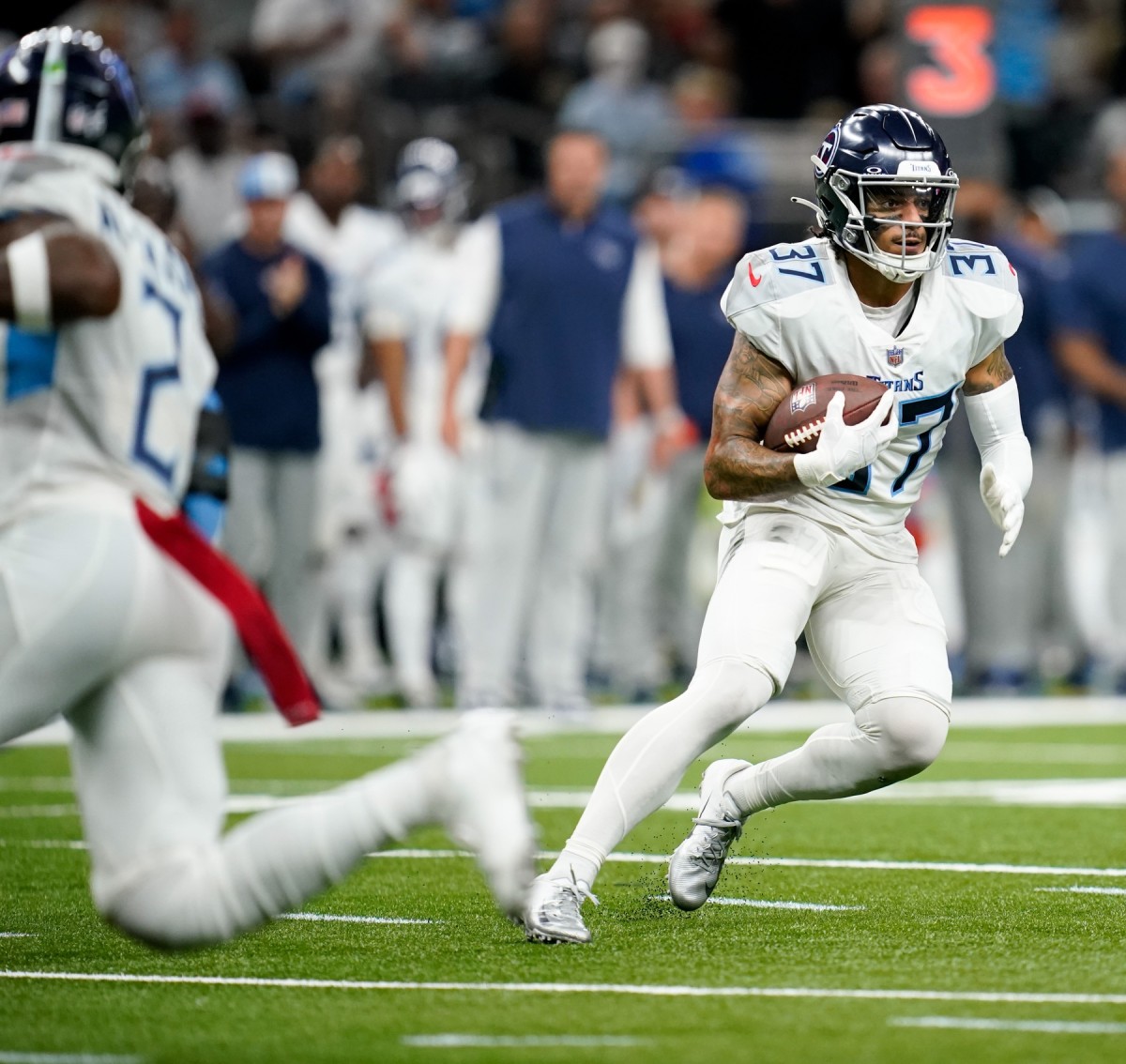 Tennessee Titans safety Amani Hooker (37) runs the ball after getting an interception against the New Orleans Saints.