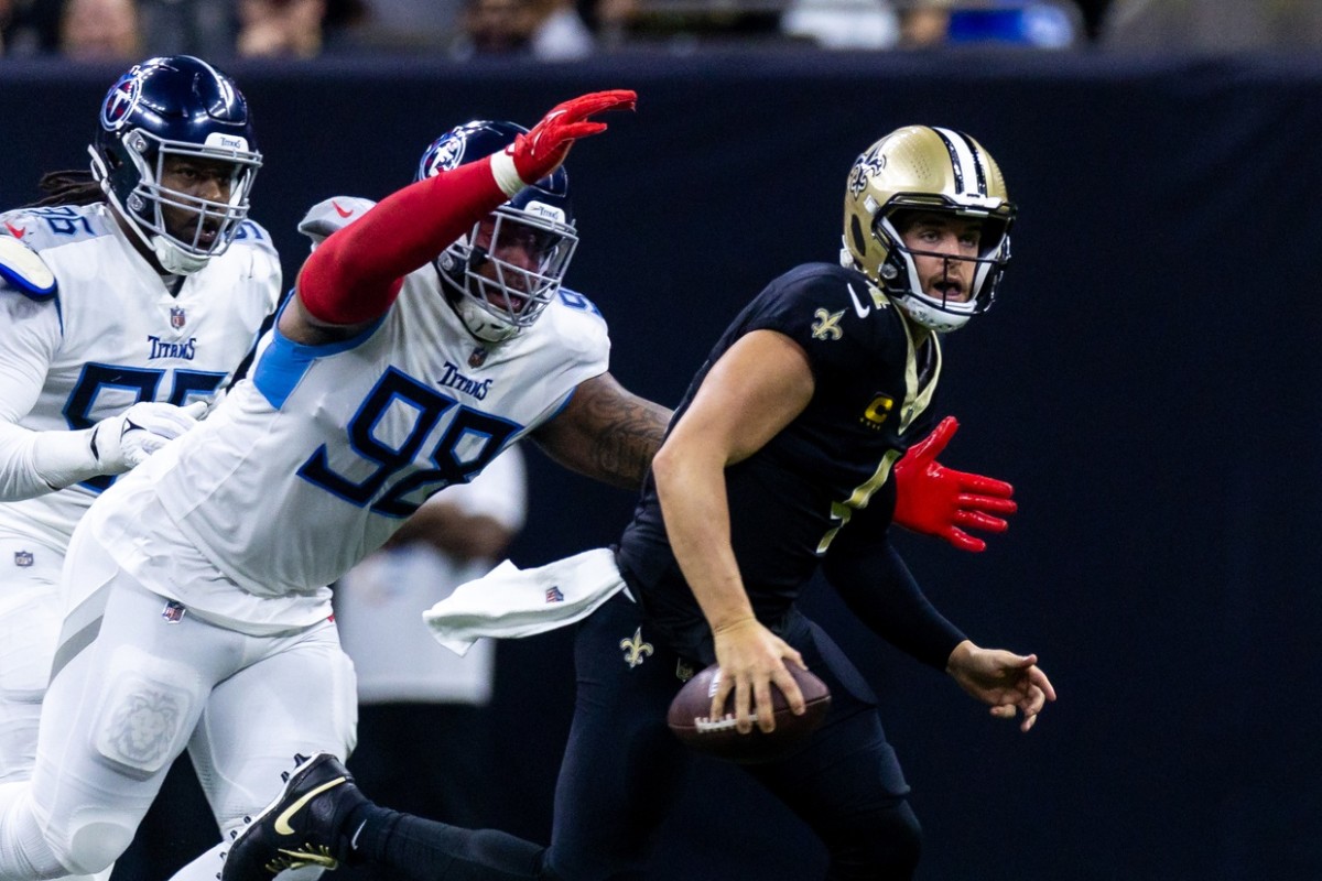 New Orleans Saints quarterback Derek Carr (4) is sacked by Tennessee Titans defensive tackle Jeffery Simmons (98).