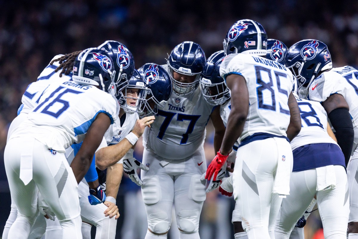 Tennessee Titans quarterback Ryan Tannehill (17) calls a play in the huddle against the New Orleans Saints.