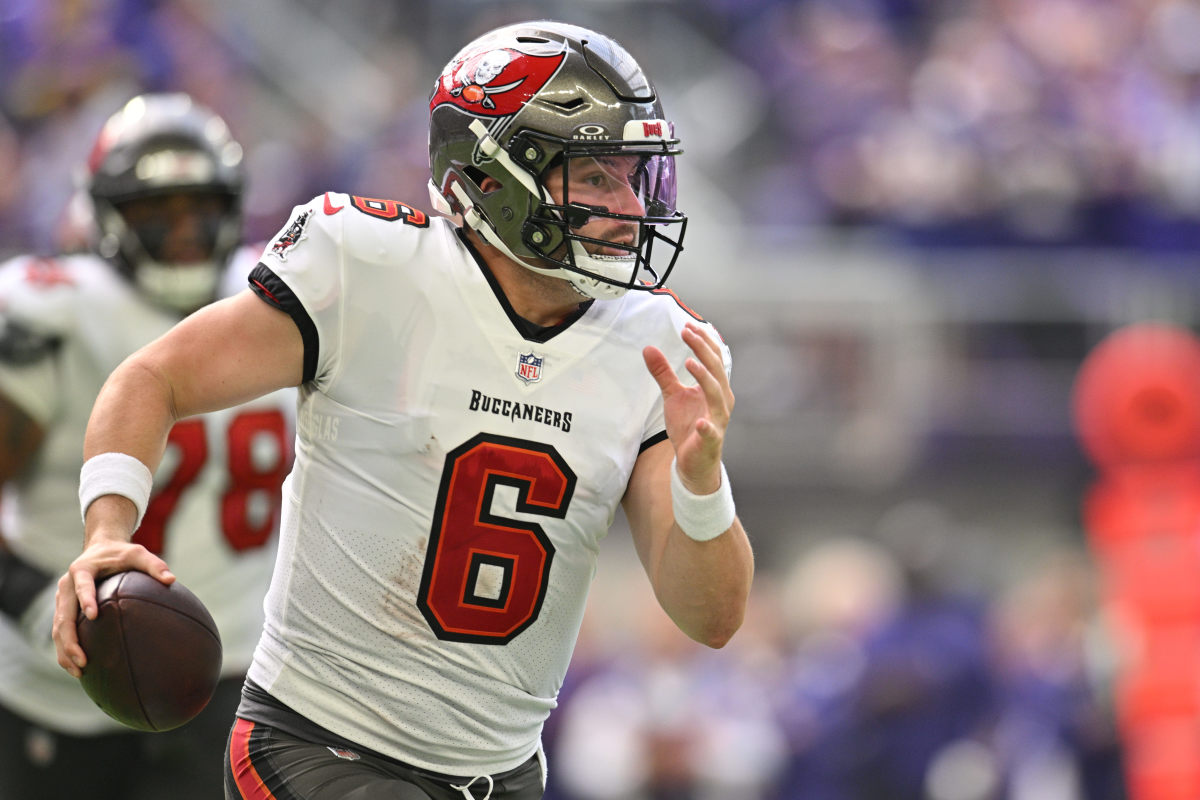 Sep 10, 2023; Minneapolis, Minnesota, USA; Tampa Bay Buccaneers quarterback Baker Mayfield (6) rolls out during the second quarter against the Minnesota Vikings at U.S. Bank Stadium. Mandatory Credit: Jeffrey Becker-USA TODAY Sports