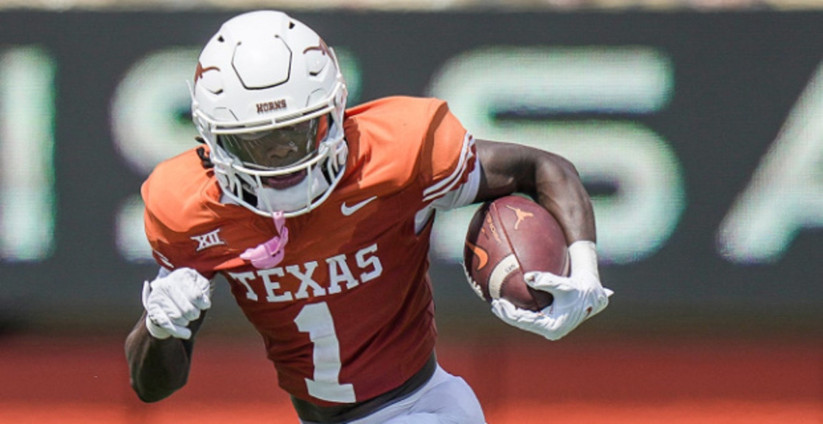 Texas Longhorns wide receiver Xavier Worthy catches a pass during a college football game.