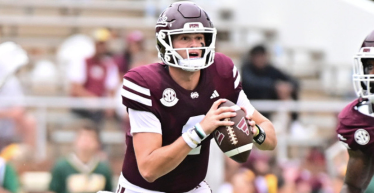 Mississippi State Bulldogs quarterback Will Rogers looks downfield on a pass attempt during a college football game.
