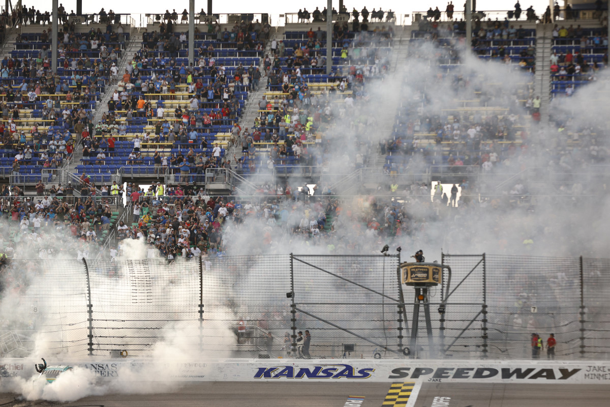 Tyler Reddick celebrates with a burnout after winning Sunday's NASCAR Cup Series Hollywood Casino 400 at Kansas Speedway. (Photo by Sean Gardner/Getty Images)