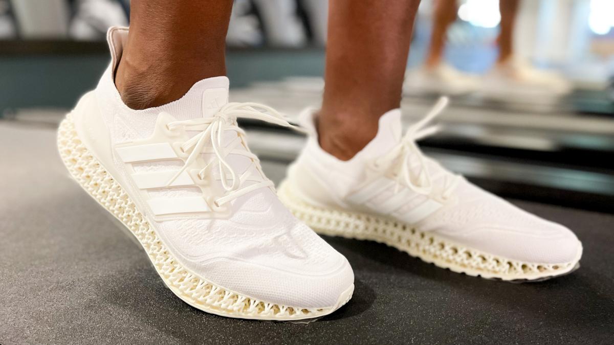 Adidas Ultra 4DFWD shoes in cream on treadmill.