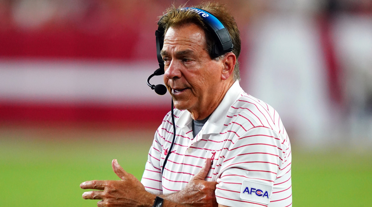 Alabama head coach Nick Saban talks into his headset on the sidelines at Bryant-Denny Stadium.