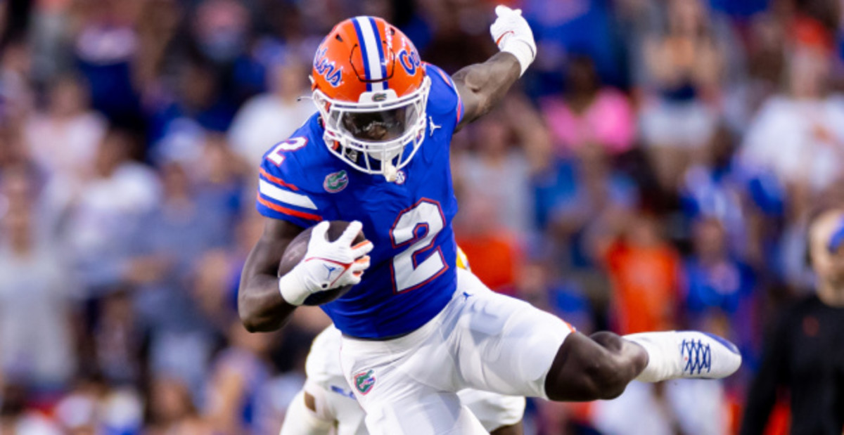 Florida Gators running back Montrell Johnson, Jr. carries the ball during a college football game in the SEC.