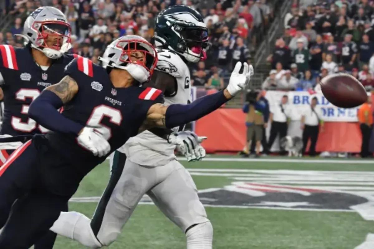 Patriots' cornerback Christian Gonzalez defends a pass against Eagles' receiver A.J. Brown.