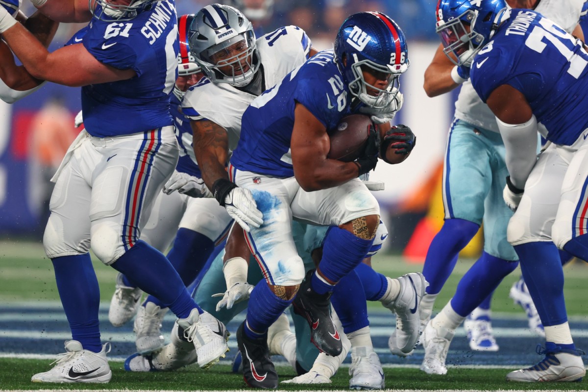 Giants running back Saquon Barkley carries against the Cowboys in Week 1.