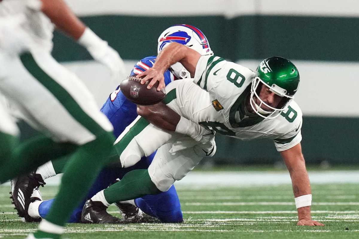 Jets quarterback Aaron Rodgers is sacked by the Bills' Leonard Floyd during the first quarter Monday night. Rodgers torn his Achilles on the play and is out for the season.