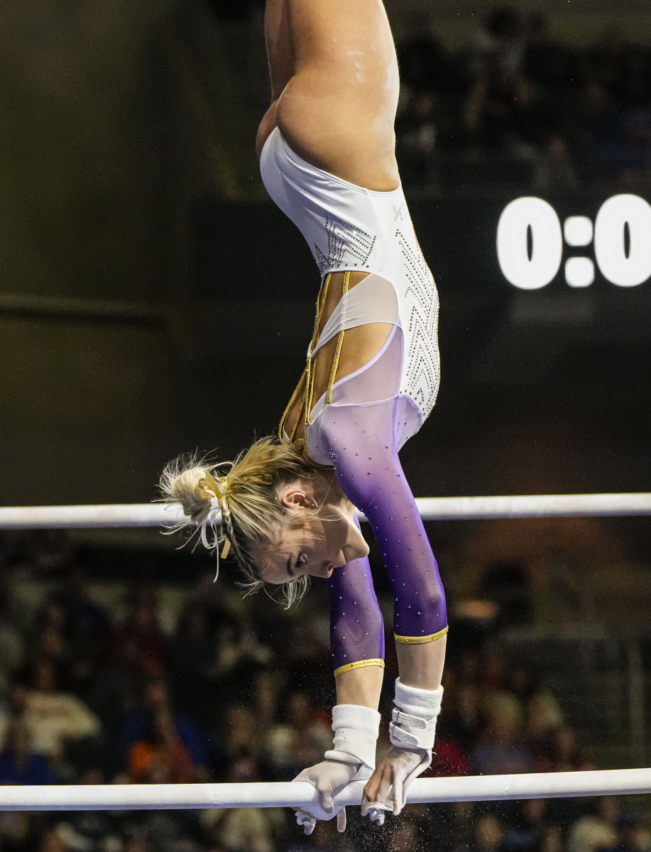 LSU gymnast Olivia Dunne does a handstand on the uneven bars while competing during the SEC Gymnastics Championship.