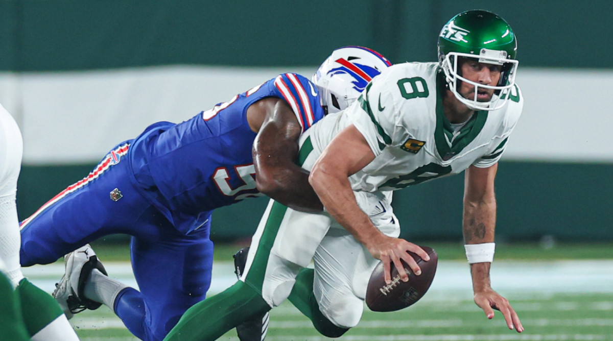 Jets quarterback Aaron Rodgers is sacked by Bills defender Leonard Floyd.