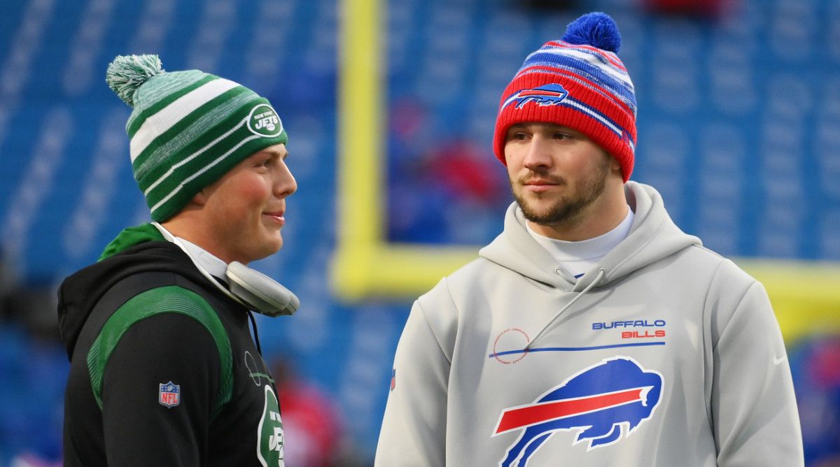 Jets quarterback Zach Wilson chats with his Bills counterpart Josh Allen before a 2022 game at Buffalo.