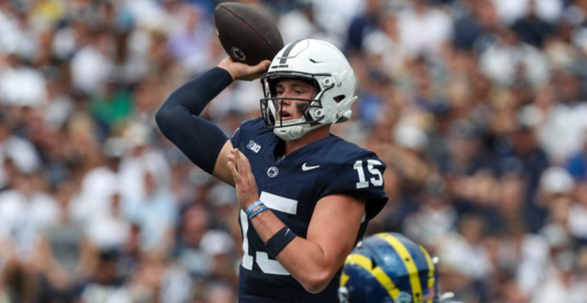 Penn State Nittany Lions quarterback Drew Allar attempts a pass during a college football game in the Big Ten.