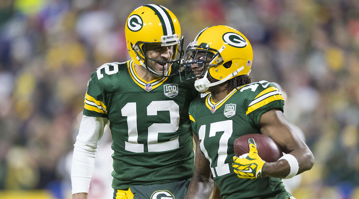 Packers quarterback Aaron Rodgers (12) celebrates with wide receiver Davante Adams (17) following a touchdown during the first quarter against the 49ers.